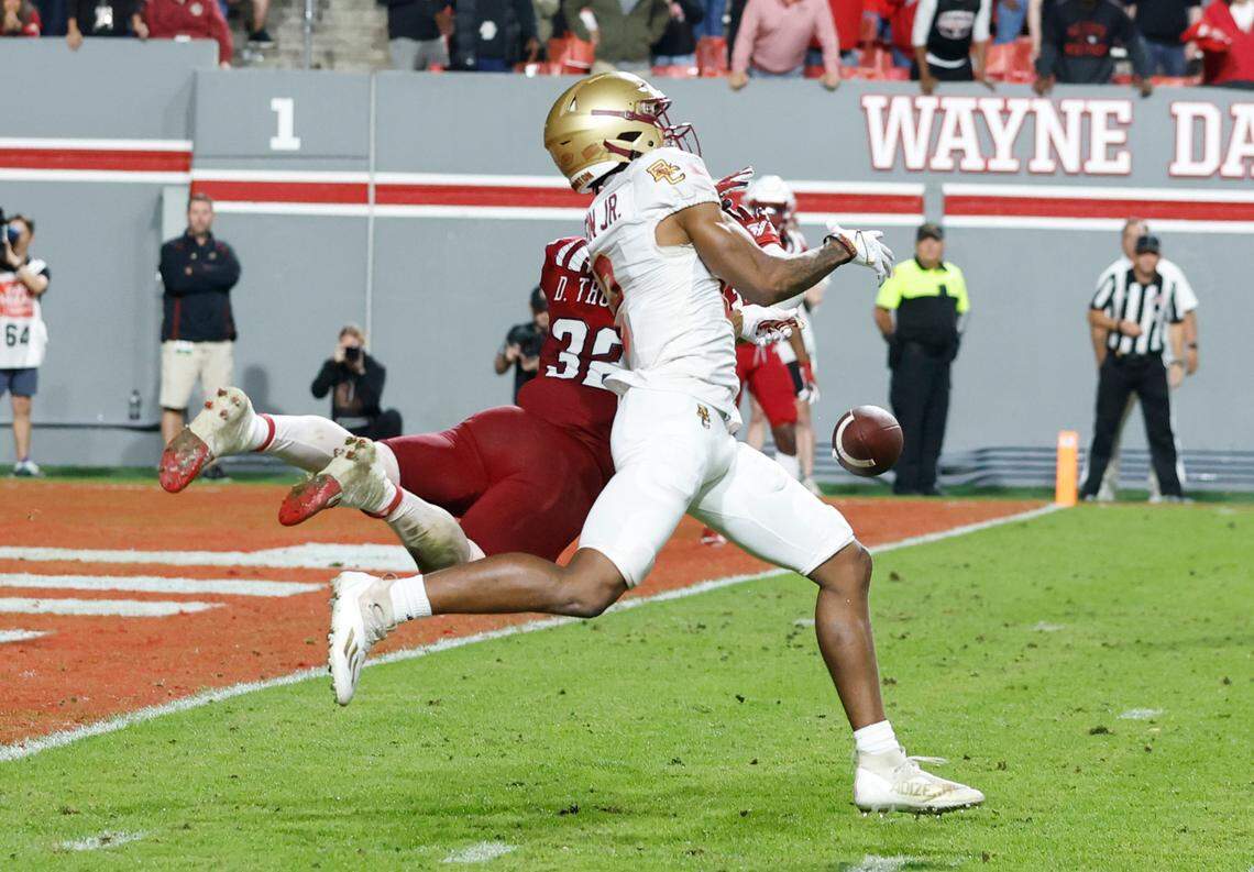 On fourth and six, N.C. State linebacker Drake Thomas (32) is called for pass interference as he defends Boston College wide receiver Joseph Griffin Jr. (2) late in the fourth quarter of Boston College’s 21-20 victory over N.C. State at Carter-Finley Stadium in Raleigh, N.C., Saturday, Nov. 12, 2022.