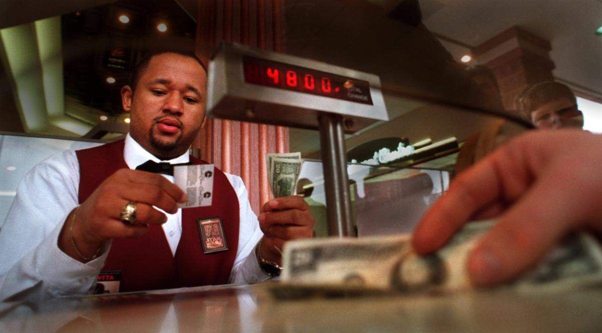 William Torian, of Hillsborough, sells $48.00 worth of tickets for the 12:30 a.m. showing of Star Wars at the Wynnsong Cinema 10 in Durham on Jan. 31, 1997.