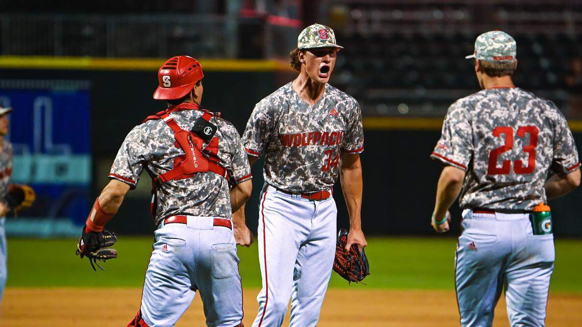 NC State pitcher Evan Justice, middle, celebrates during the Wolfpack’s win over Pitt on Thursday.
