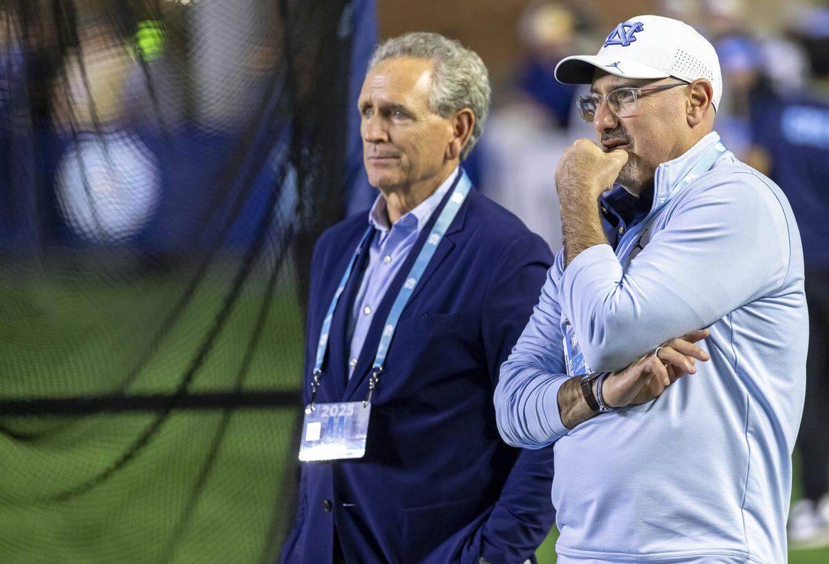 North Carolina athletic director Bubba Cunningham and associate athletic director Steve Newmark chat during the Tar Heels’ game against Stanford on Saturday, November 8, 2025 at Kenan Stadium in Chapel Hill, N.C.