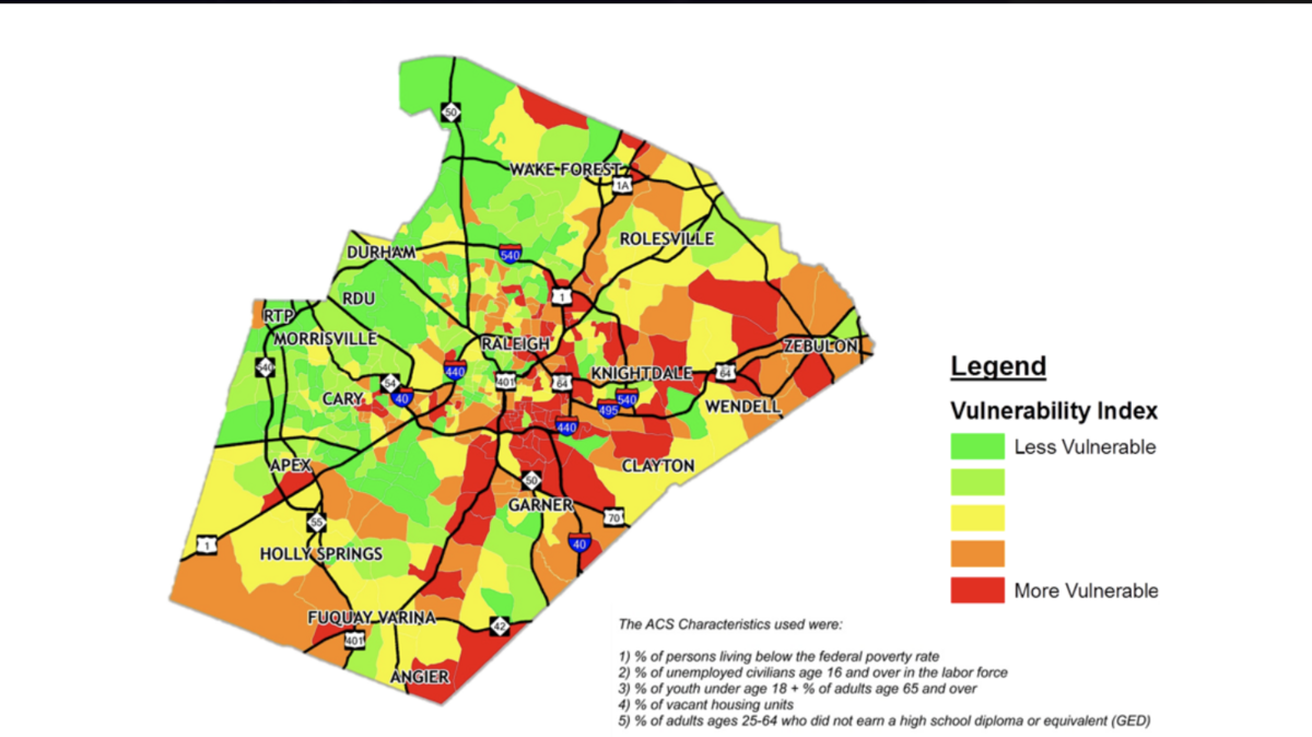 Wake County commissioners reviewed a graph of vulnerable communities in Wake County, where darker red indicates communities are more vulnerable than others.