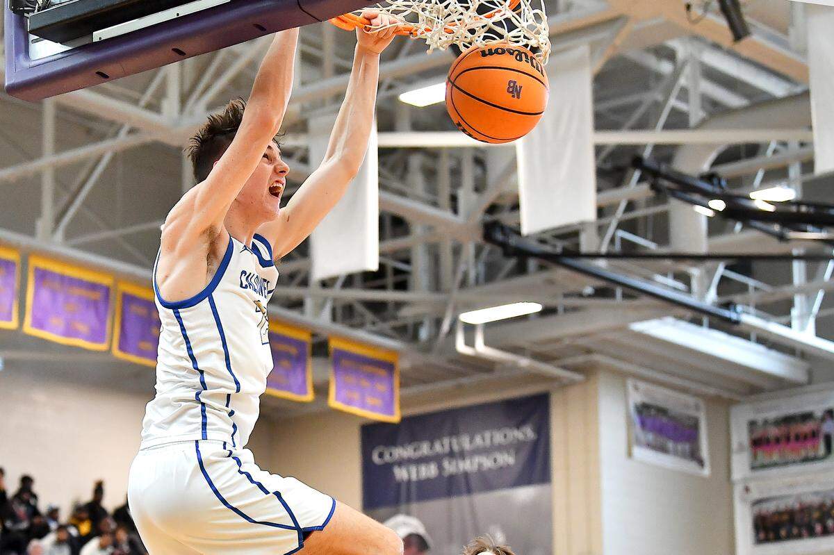 Caldwell Academy ‘s Cole Cloer (23) slams home town points against Davidson Day during the second half of the John Wall Invitational Tournament. The Davidson Day Patriots and the Caldwell Academy Eagles met in the John Wall Holiday Invitational Tournament in Raleigh, N.C. on December 26, 2024.