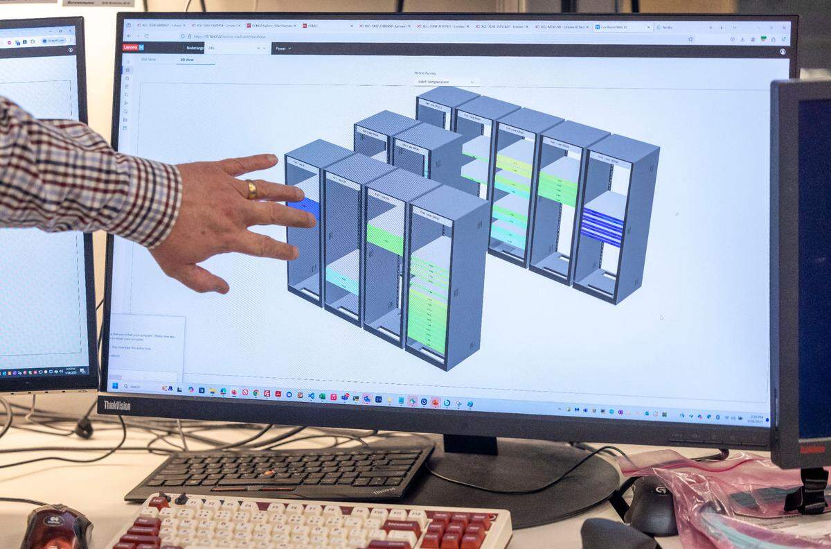 Andrew Wray, senior engineer for high performance computing, explains how heat output is monitored in a data center at Lenovo on Tuesday, January 28, 2025 in Morrisville, N.C.