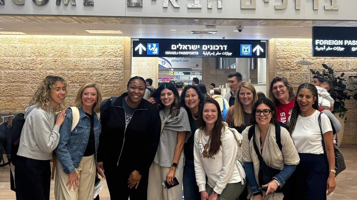 Commissioner Vickie Adamson, in a red shirt second to last on the right side of the photo, poses for a photo in Israel.
