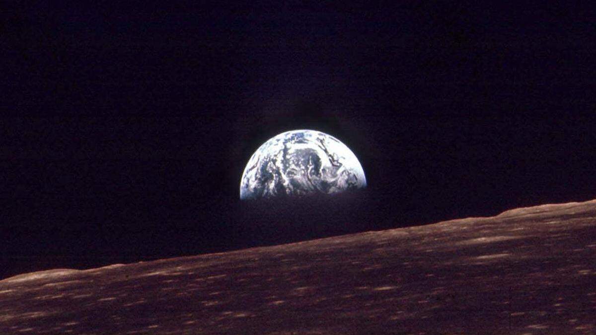 FILE - In this Dec. 24, 1968 file photo, the Earth shines over the horizon of the Moon in as seen by the astronauts on Apollo 8. Apollo 8 was launched from Cape Canaveral on Dec. 21, 1968. (AP Photo/FILE)