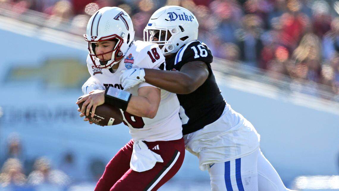 Duke Blue Devils defensive linemen Aeneas Peebles (16) sacks Troy Trojans quarterback Gunnar Watson (18) during their bowl game in Birmingham, Ala. Saturday, Dec. 23, 2023.