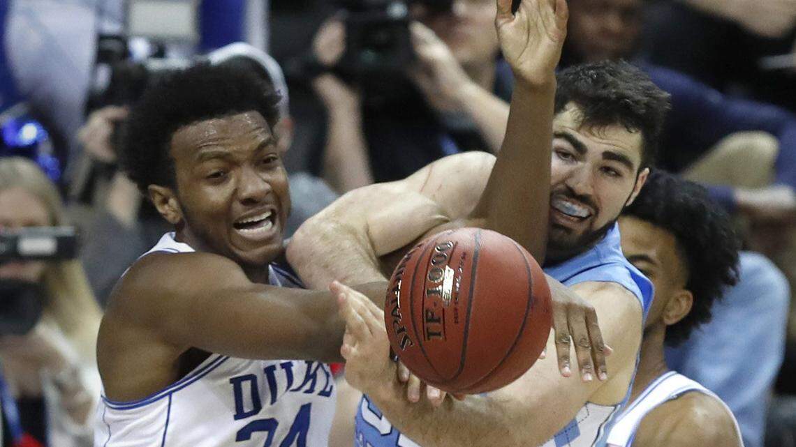 North Carolina's Luke Maye (32) fights for the rebound with Duke's Wendell Carter Jr (34) during the second half.
