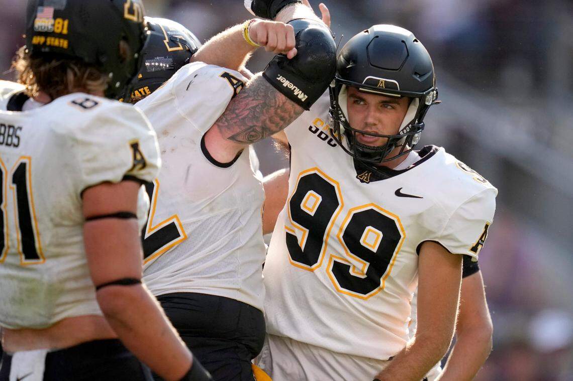Appalachian State place kicker Michael Hughes (99) reacts with teammate Bucky Williams, left, after kicking a field goal against Texas A&M during the second half of an NCAA college football game Saturday, Sept. 10, 2022, in College Station, Texas.