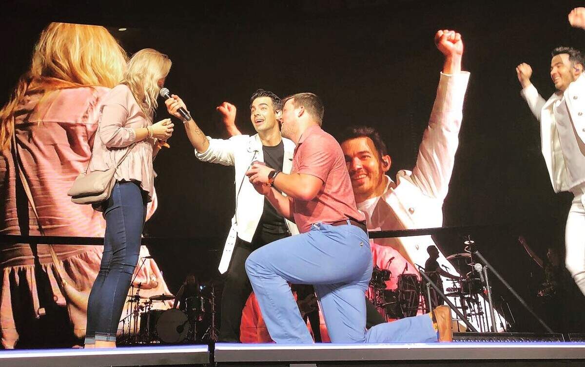 Dylan Goyer of Raleigh proposes to Brittney Overstreet of Concord at the Jonas Brothers concert Aug. 14, 2019, in Raleigh, North Carolina.