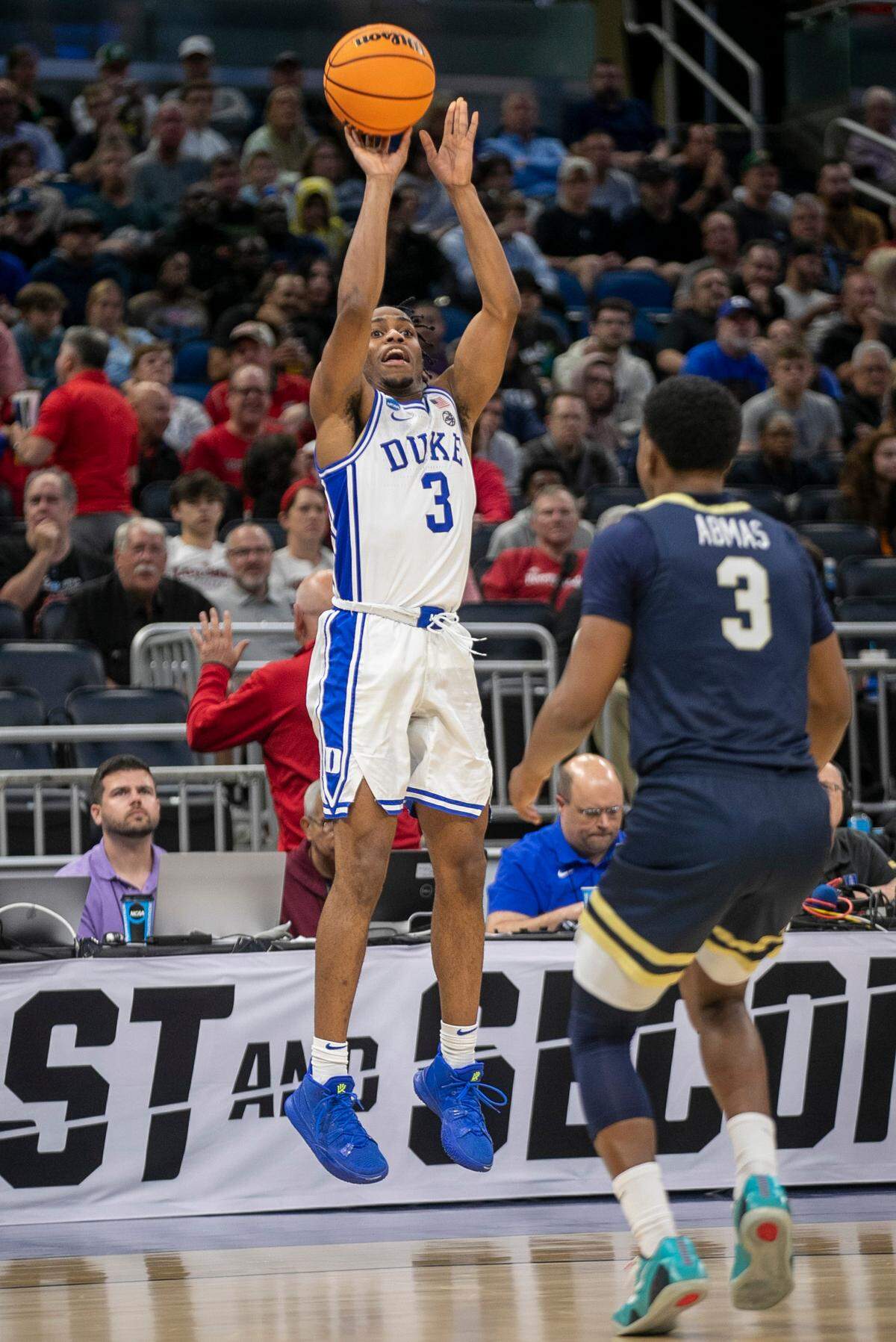 Duke’s Jeremy Roach (3) launches a three point shot over Oral Roberts’ Max Abmas (3) in the second half during the first round of the NCAA Tournament on Thursday, March 16, 2023 at the Amway Center in Orlando, Fla.