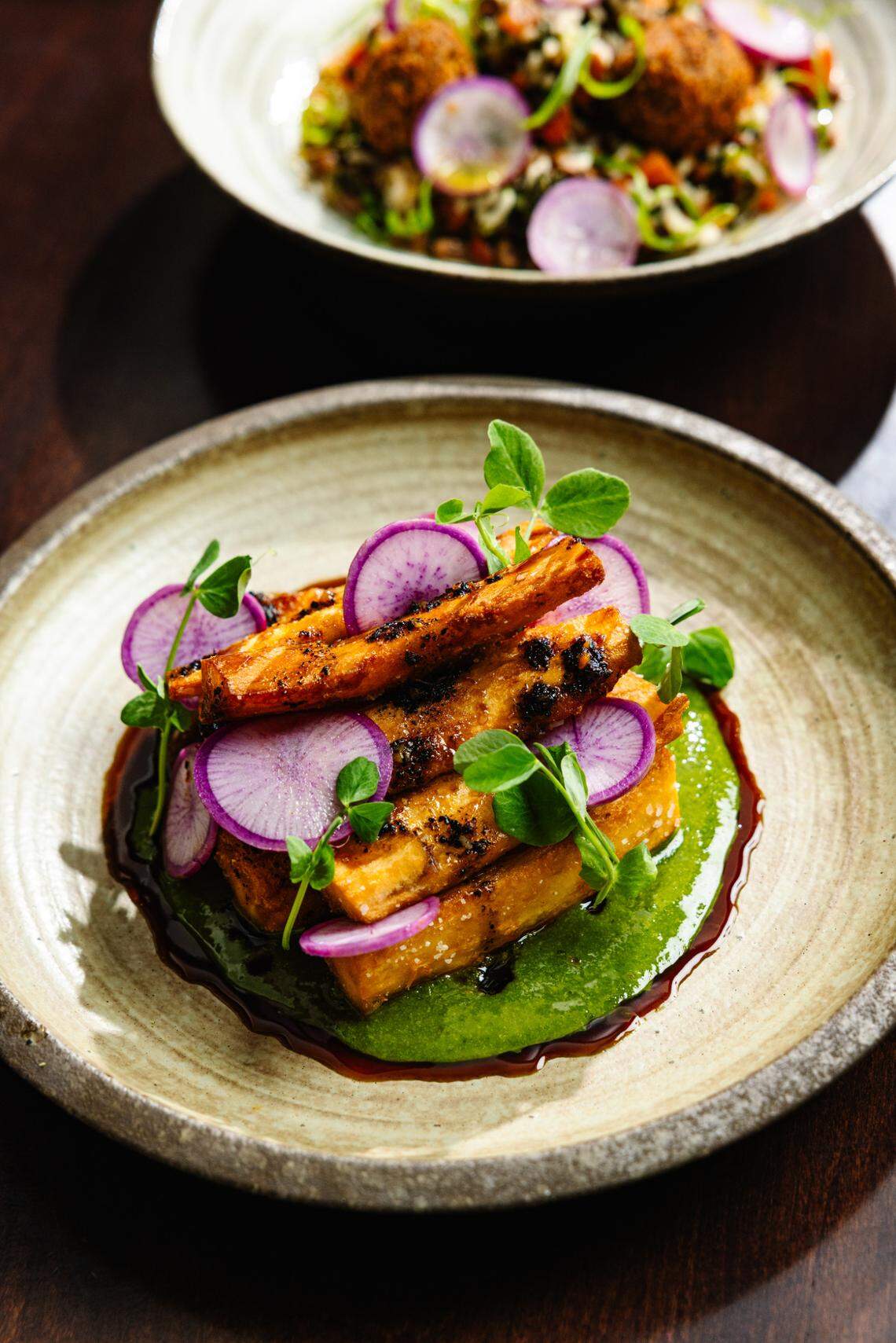 A plate of crispy yuca is one of chef Greg Gettles new favorite dishes on the menu at Peck & Plume.