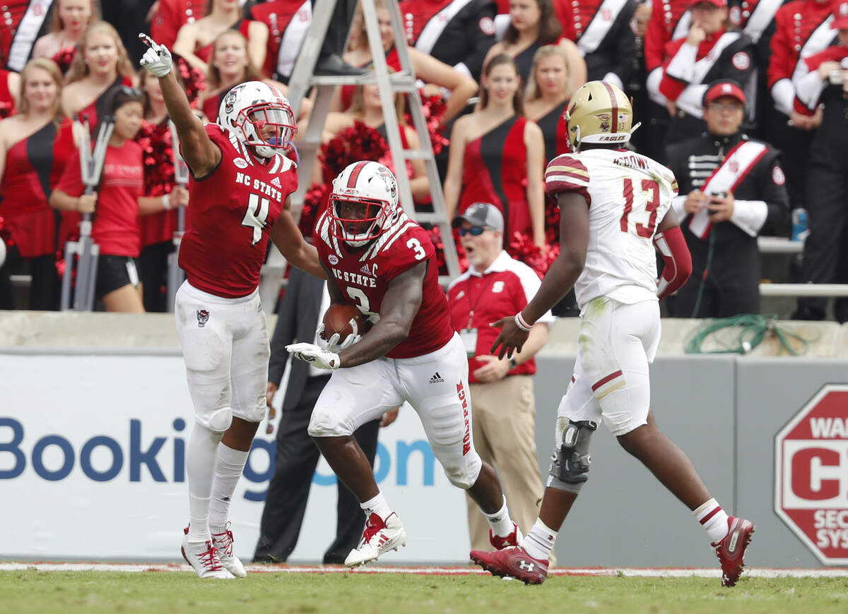 N.C. State linebacker Germaine Pratt (3) and Nick McCloud (4) celebrate after Pratt stripped the ball from Boston College’s Ben Glines during the second half of N.C. State’s 28-23 victory over Boston College at Carter-Finley Stadium in Raleigh, N.C., Saturday, Oct. 6, 2018.