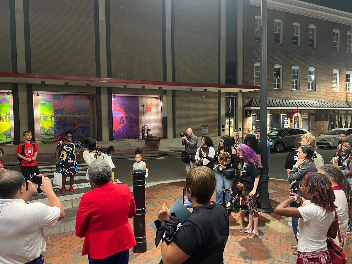 Residents gather outside Durham City Hall Aug. 4, 2025, after the developer of a controversial development for the Hayti district withdraws its rezoning application and the council approves the withdrawal.