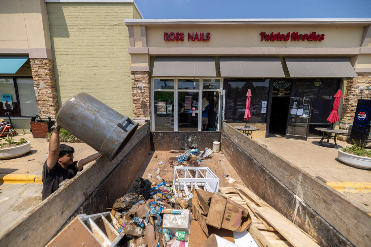 Storm debris and water damaged items from Rose Nails in the Eastgate Shopping Center are discarded on Tuesday, July 8, 2025 in Chapel Hill, N.C. Most of the businesses in Eastgate were flooded by heavy rain from Tropical Storm Chantal on Sunday.