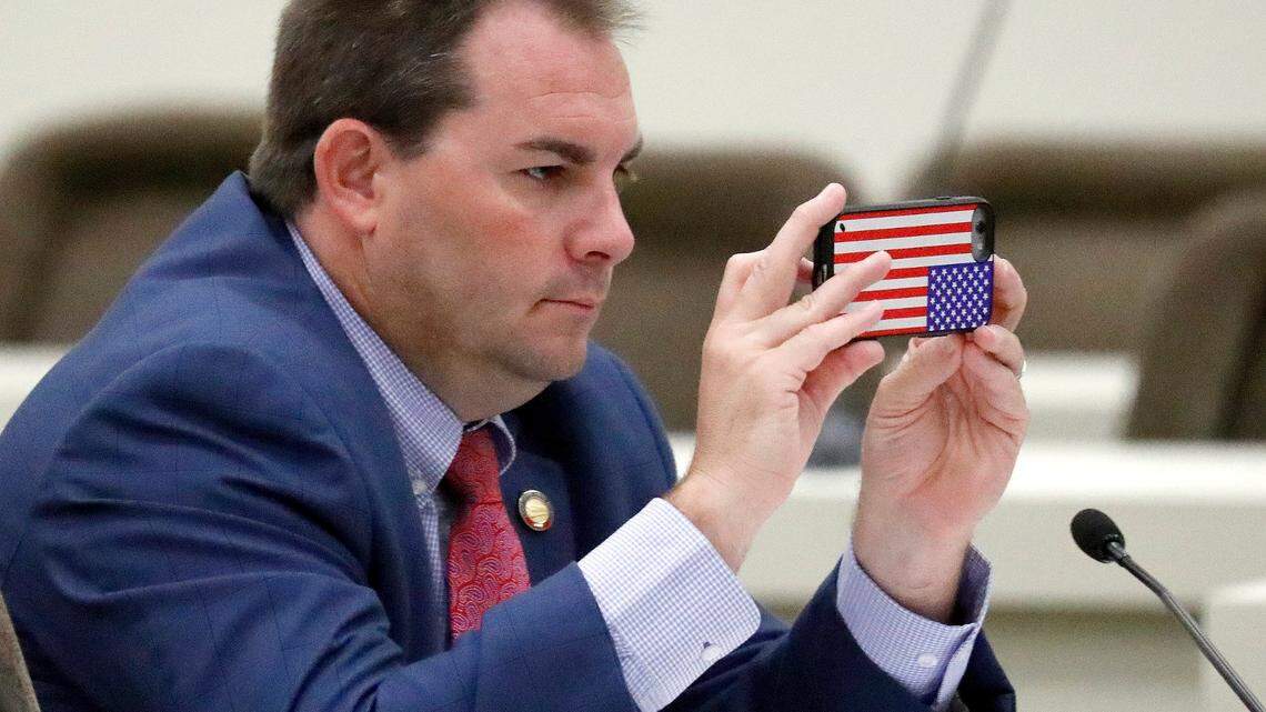 NC House Rep. John Bell (R-Craven, Greene, Lenoir, Wayne) takes a picture during discussion of an early voting bill during a House Rules Committee meeting held at the Legislative Office Building in Raleigh on June 14, 2018. The committee discussed adjusting the days and hours of early voting locations, making it more uniform across the state.