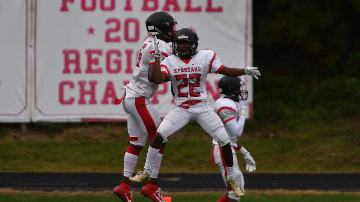 Southern Durham’s Jacquez Warren, left, celebrates a touchdown against Apex Friendship with teammate Logan Harper (22) during the HSOT Jamboree on Saturday, Aug. 17, 2019.