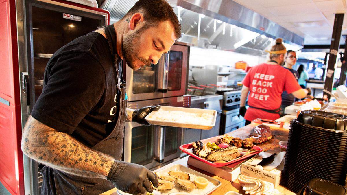 Chef Jake Wood in the kitchen at his restaurant, Lawrence BBQ, located in the new Boxyard RTP on Friday, Dec. 3, 2021.