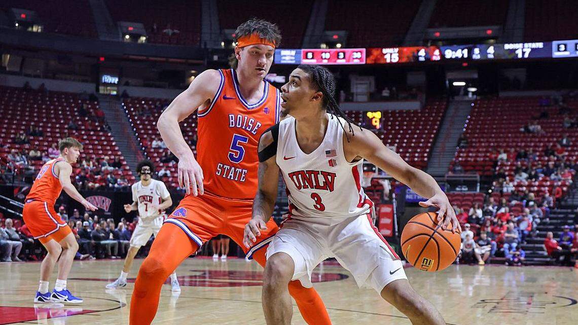 Howie Fleming Jr. (3) of the UNLV Rebels is guarded by RJ Keene (5) of the Boise State Broncos in the first half of their game at the Thomas & Mack Center on Jan. 13, 2026 in Las Vegas, Nevada.