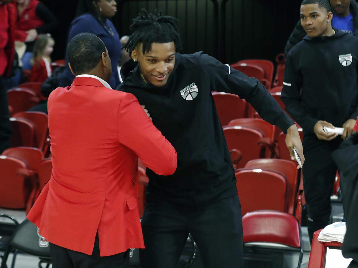 N.C. State coach Kevin Keatts greets Josh Hall after the Wolfpack’s 95-64 victory over St. Francis Brooklyn at Reynolds Coliseum in Raleigh, N.C., Saturday, Nov. 16, 2019.
