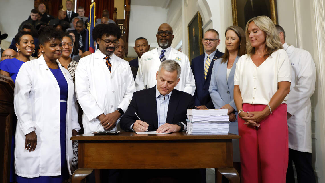 NC budget with year-delayed raises is now law. Gov. Stein signs spending plan