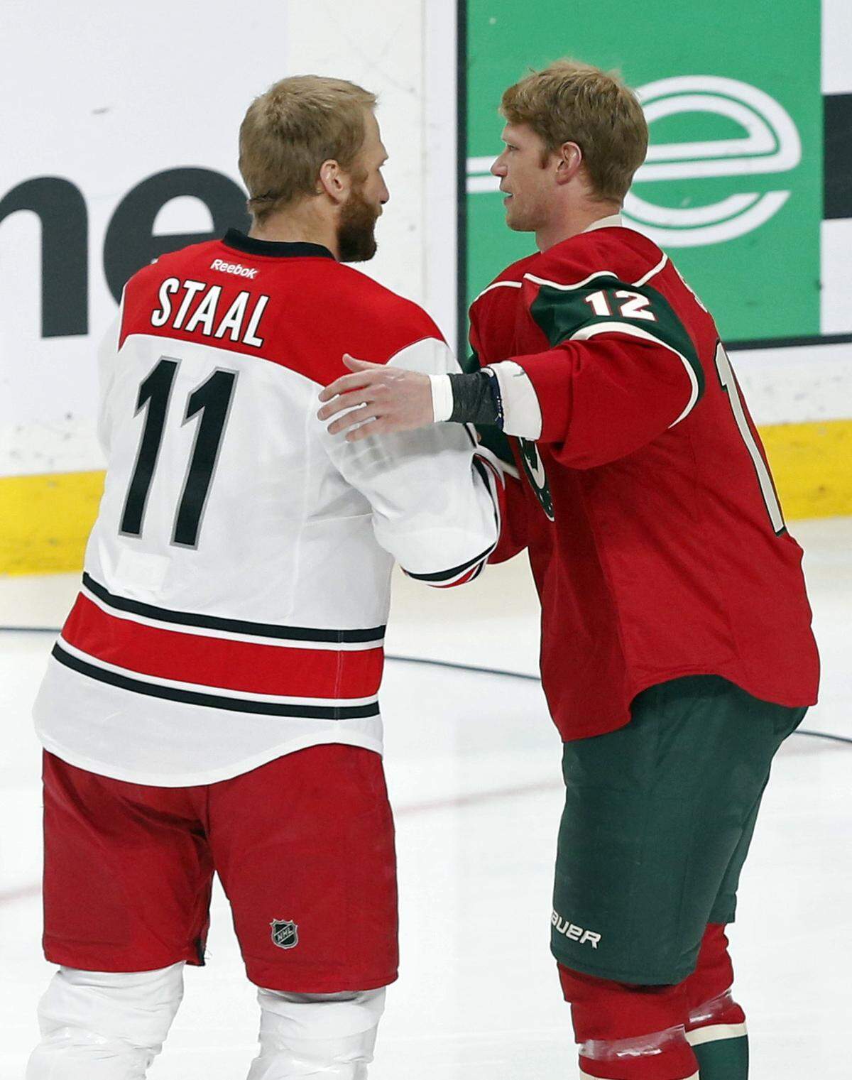 Carolina Hurricanes’ Jordan Staal, left, congratulates his brother, Minnesota Wild’s Eric Staal after a ceremony honoring Eric for his 1,000th game prior to their NHL hockey game Tuesday, April 4, 2017, in St. Paul, Minn. (AP Photo/Jim Mone)