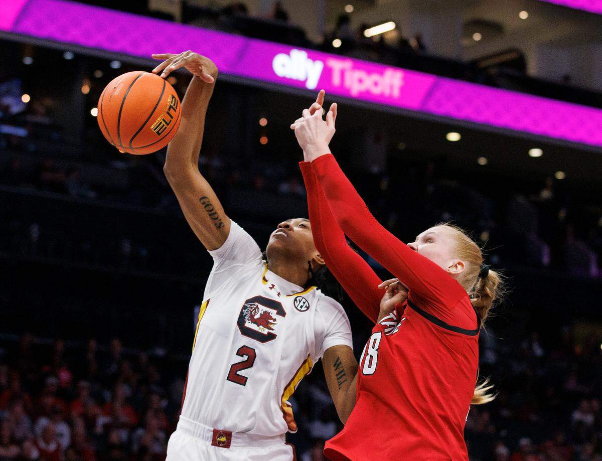 South Carolina’s Ashlyn Watkins and N.C. State’s Tilda Trygger battle for a rebound during the second half of the Wolfpack’s 71-57 loss on Sunday, Nov. 10, 2024, at Spectrum Center in Charlotte, N.C.