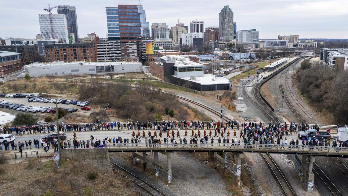 Thousands pack downtown Raleigh to see monks passing through as they Walk for Peace