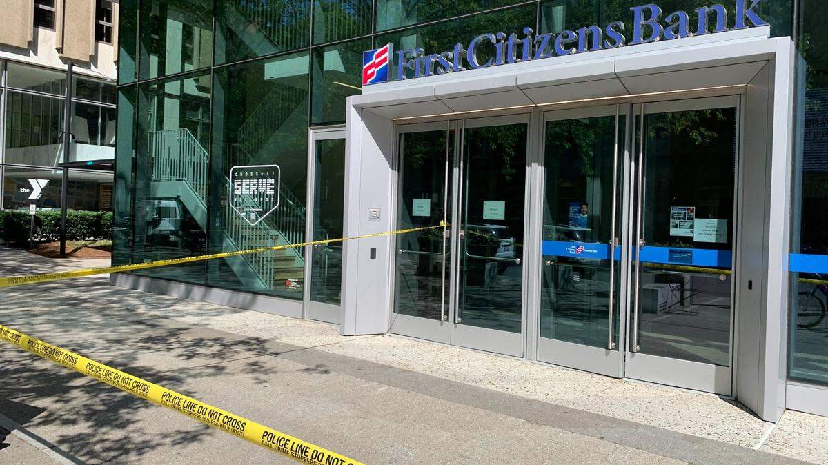 Raleigh police officers are investigating a robbery at First Citizens Bank at 239 Fayetteville Street in downtown Raleigh, NC, on April 4, 2023.