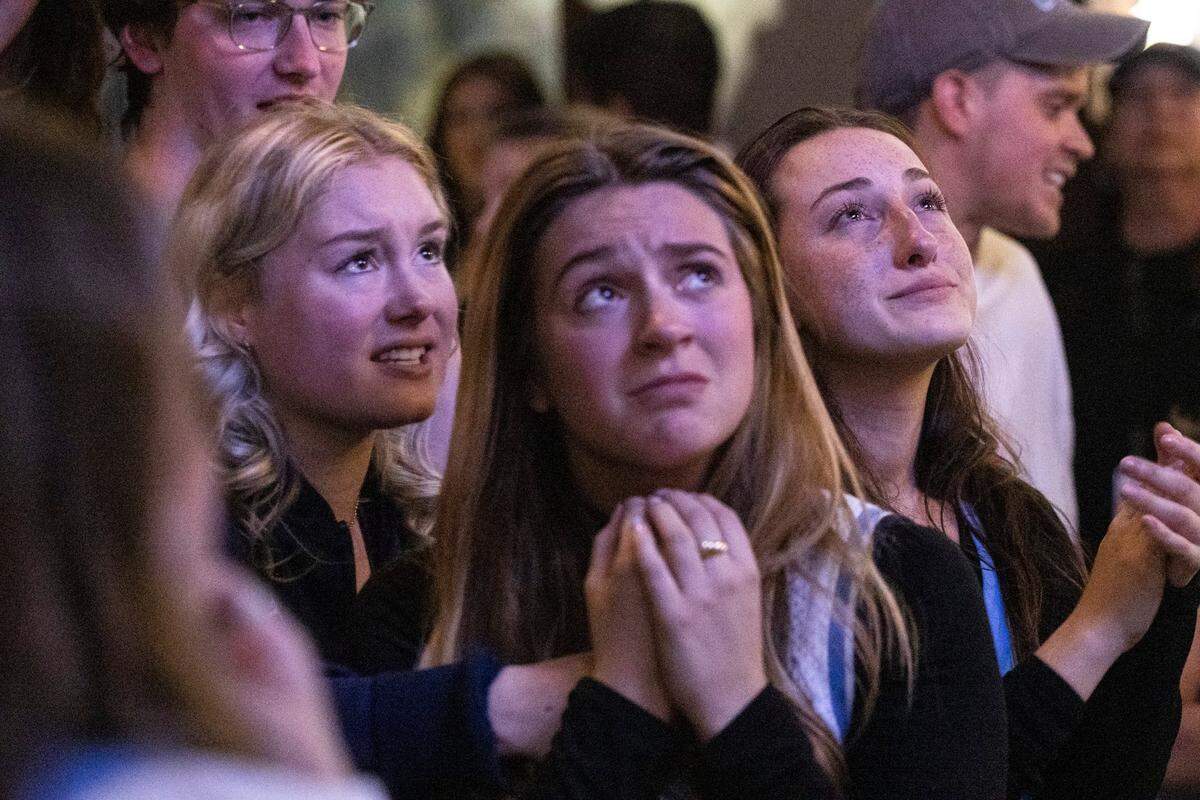 UNC fans watch the final moments of the NCAA Men’s Division I Basketball Championship against Kansas Monday, April 4, 2022 at Top of the Hill Restaurant & Brewery in Chapel Hill. UNC lost 72-69.