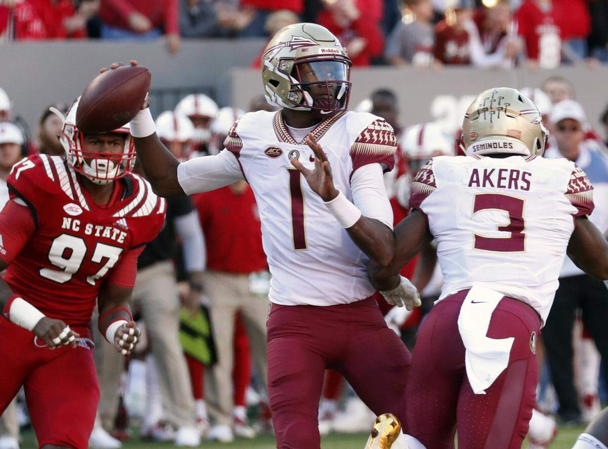 In this Nov. 3, 2018, file photo. Florida State’s James Blackman (1) looks to pass during the first half of the team’s NCAA college football game against North Carolina State in Raleigh, N.C.