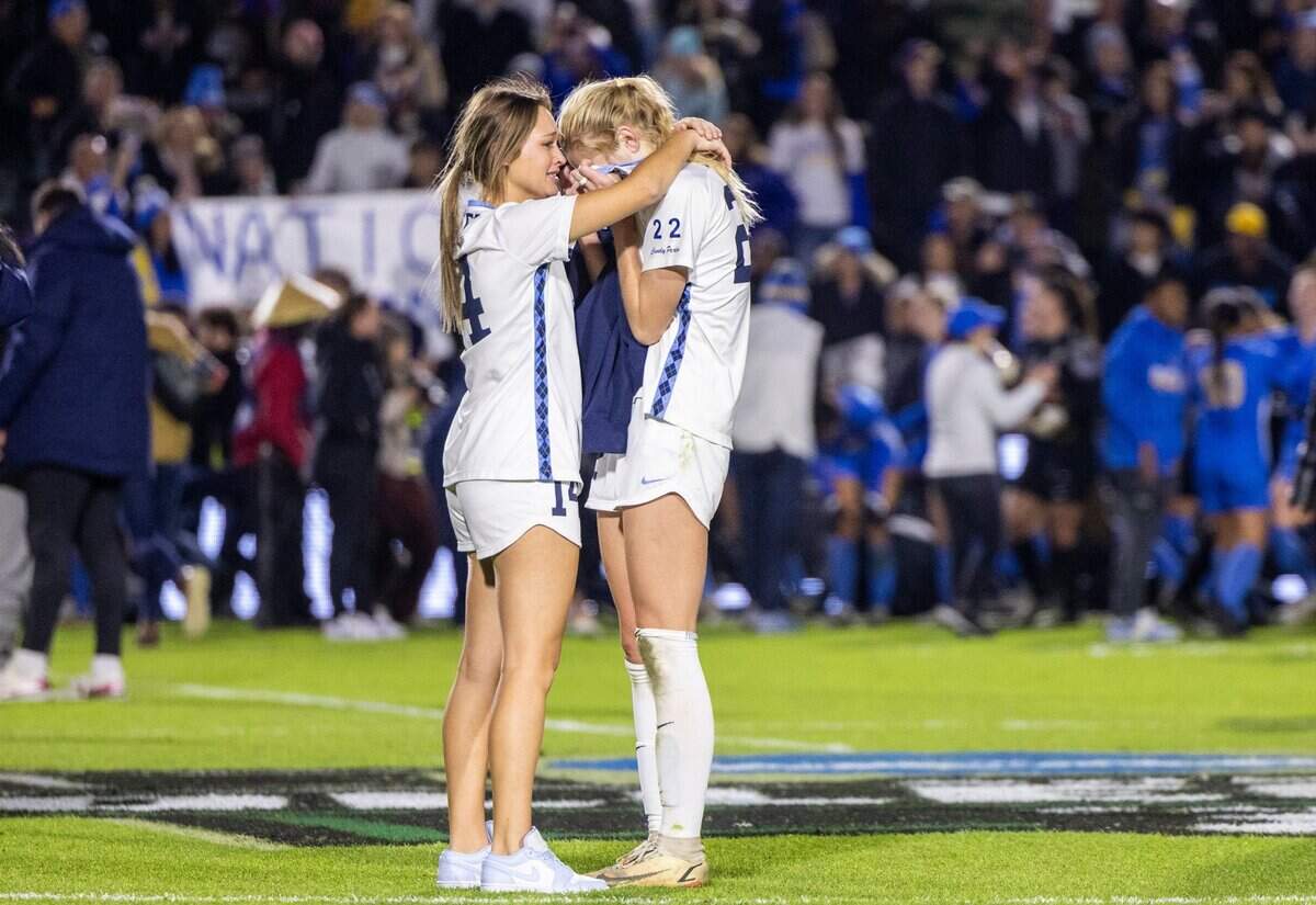 UNC-Chapel Hill’s (14) and (22) comfort each other after a 3-2 overtime loss to UCLA during the NCAA Division I Championship at WakeMed Soccer Park in Cary Monday, Dec. 5, 2022.