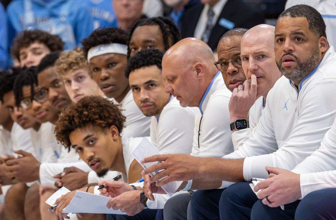 North Carolina coach Hubert Davis, his assistant coaches, along with Seth Trimble (7), watch the opening minute of play against California on Wednesday, January 15, 2025 at the Smith Center in Chapel Hill, N.C.