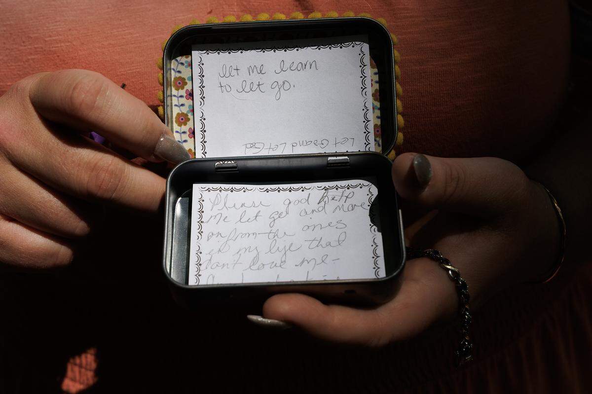 Nicole Holliday, photographed at her home in Wake Forest on Friday, April 17, 2026, holds a prayer box that belonged to her mother, Victoria Benhoff. Benhoff died in March 2025 after ingesting fentanyl. 