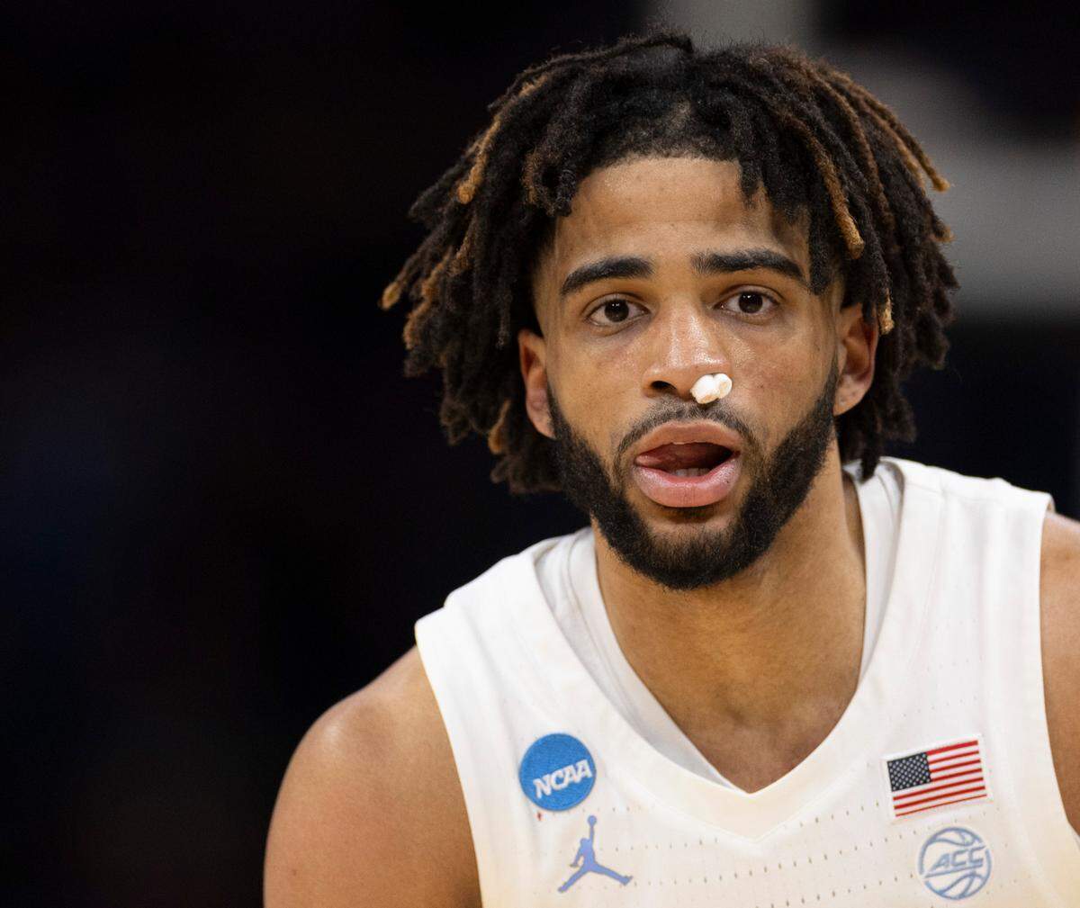 North Carolina’s R.J. Davis (4) plays the first half against Wagner with his nostril packed with cotton pads after a collision caused a bloody nose on Thursday, March 21, 2024 during the NCAA Tournament at Spectrum Center in Charlotte, N.C.