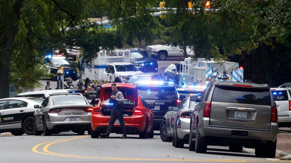 A heavy law enforcement and first responder presence is seen on South Street near the Bell Tower on the campus of the University of North Carolina in Chapel Hill, N.C. Monday afternoon, Aug. 28, 2023 after a report of an “armed and dangerous person”.