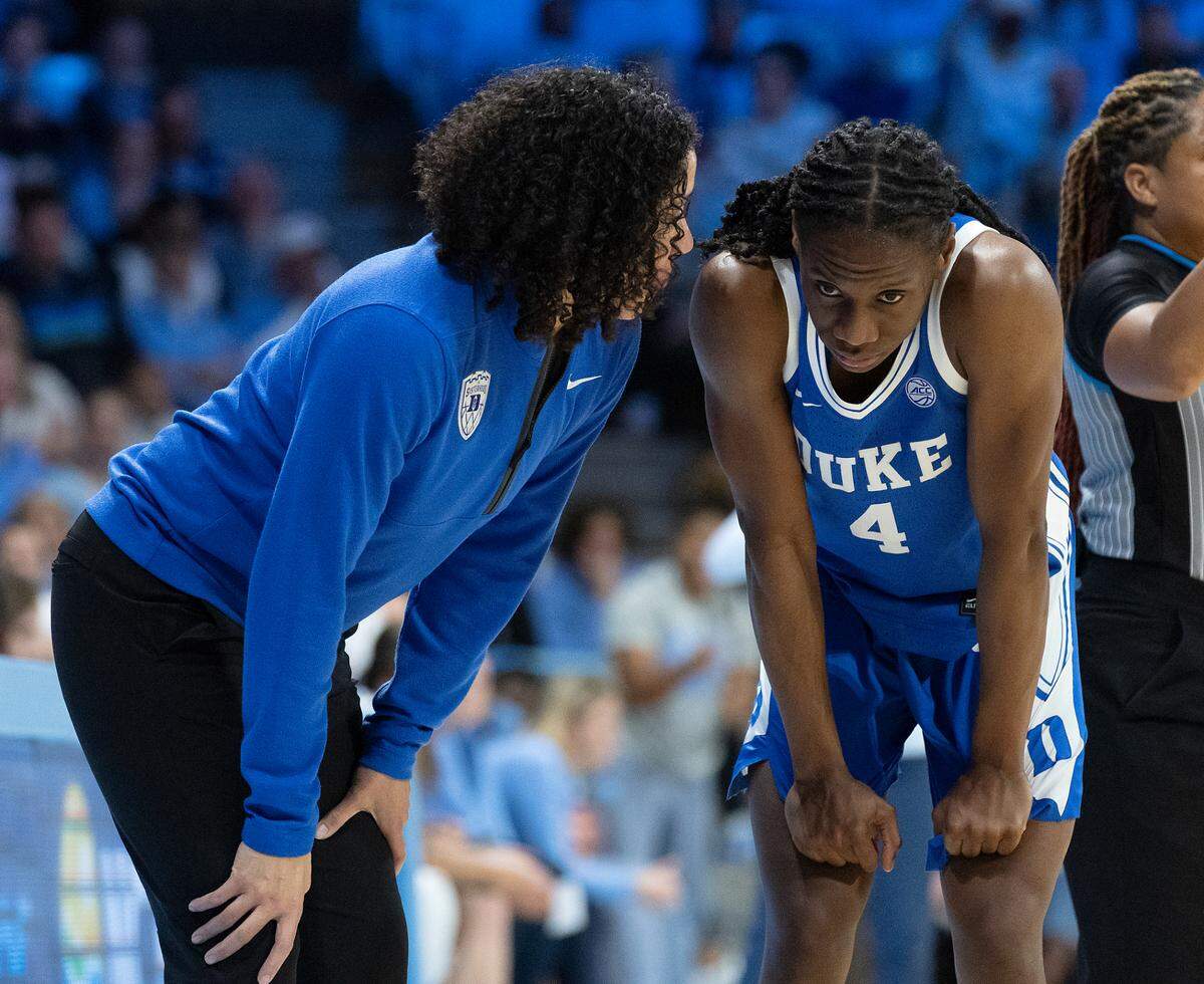 Duke head coach Kara Lawson speaks with Jadyn Donovan during the second half of the Blue Devils’ 53-46 overtime loss to North Carolina on Thursday, Jan. 9, 2025, at Carmichael Arena in Chapel Hill, N.C.