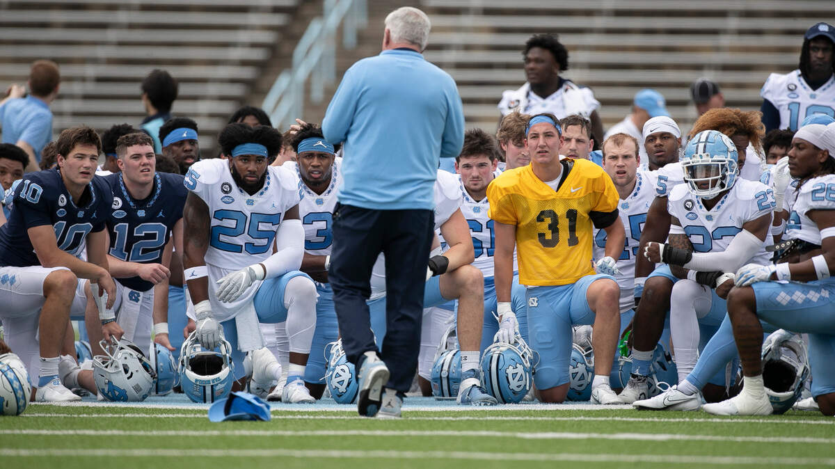 North Carolina head coach Mack Brown talks with his team prior to their spring football game on Saturday, April 15, 2023 at Kenan Stadium in Chapel Hill, N.C.