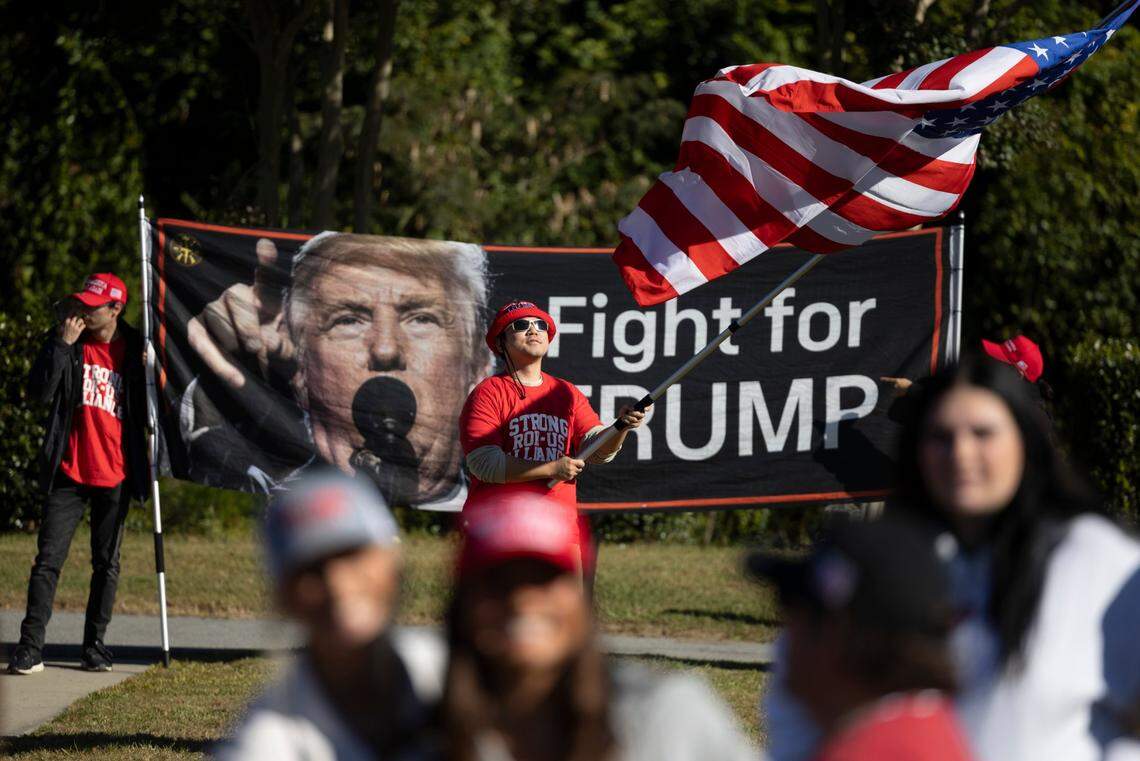 Supporters of former President Donald Trump gather outside Minges Coliseum in Greenville prior to a rally on Oct. 21, 2024. With two weeks until Election Day, Trump went on a three-city tour, in which Trump will also see the destruction caused by Hurricane Helene in Asheville and speak at a faith conference in Concord.
