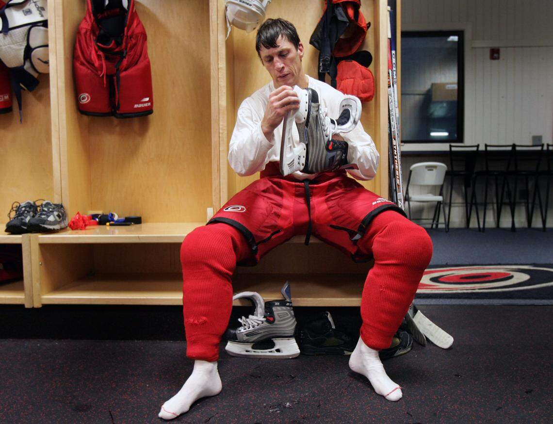 Rod Brind'Amour cleans one of his skates after practice at the RecZone skate center in Raleigh on Sept. 7, 2005.
