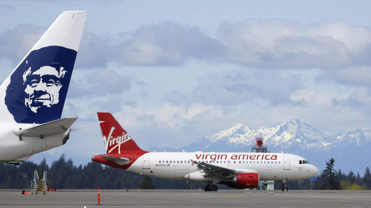 Virgin America will cease to exist as an airline brand on Wednesday, but its new owner, Alaska Airlines, says some planes with the Virgin colors and logo will continue flying until next year.