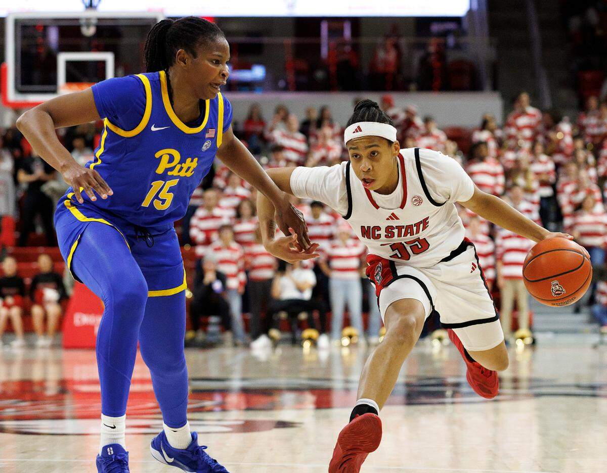 N.C. State’s Zoe Brooks drives against Pittsburgh’s Khadija Faye during the second half of the Wolfpack’s 83-67 win on Thursday, Jan. 16, 2025, at Reynolds Coliseum in Raleigh, N.C.