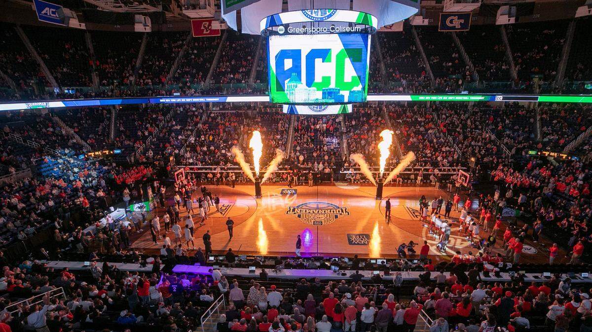 The Greensboro Coliseum is illuminated by flash pots prior to the player introductions for the Clemson vs Virginia game in the semi-finals of the ACC Tournament on Friday, March 10, 2023 at the Greensboro Coliseum in Greensboro, N.C.