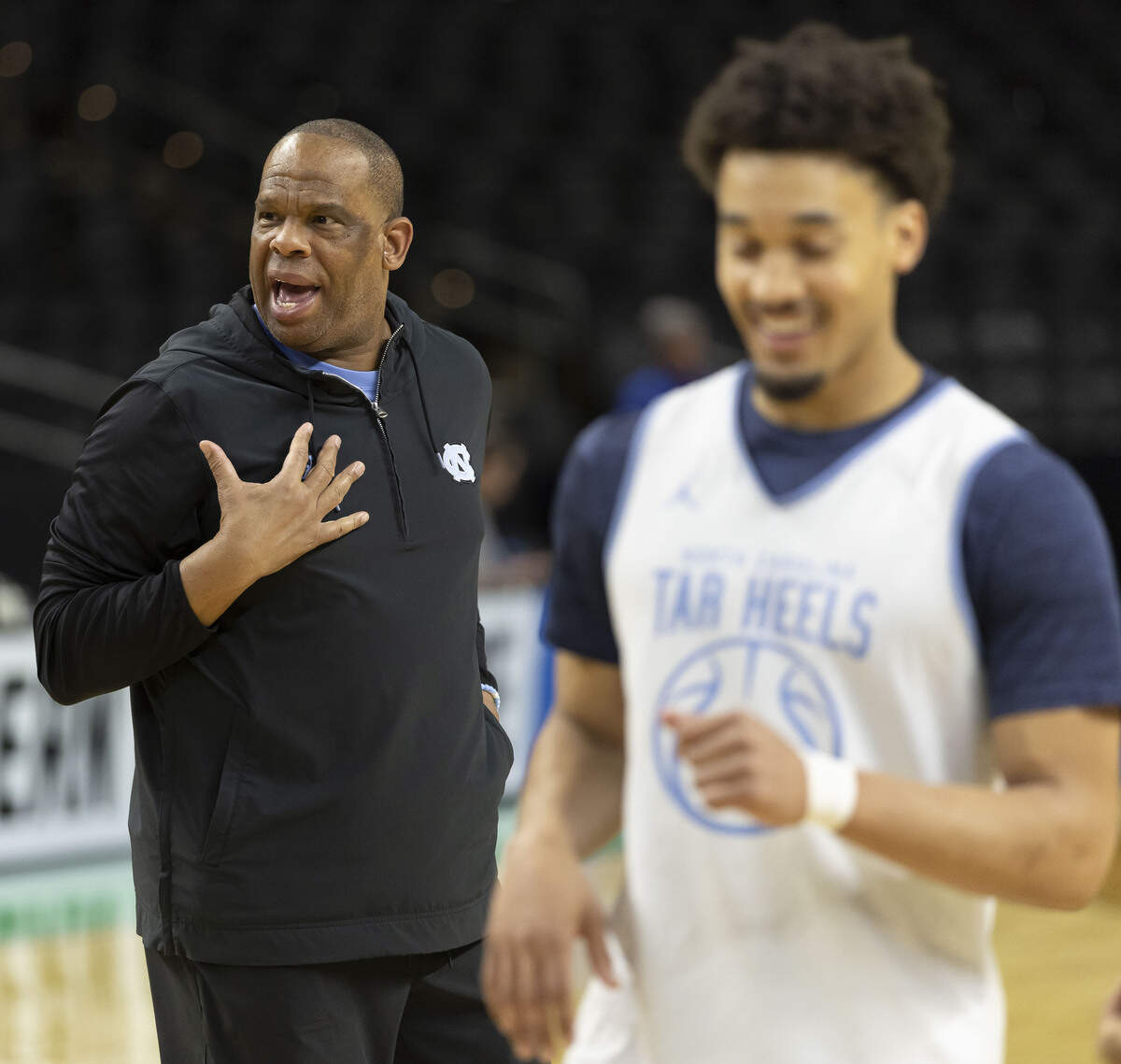 North Carolina coach Hubert Davis and guard Seth Trimble flash smiles during the Tar Heels’ practice on Wednesday, March 18, 2026, at Bon Secours Arena in Greenville, S.C.