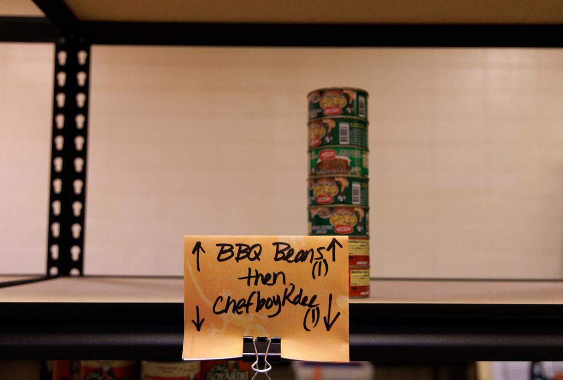 Cans sit on a shelf at a pantry maintained by Porch Hillsborough on Thursday, Nov. 14, 2024, in Hillsborough, N.C. The organization has experienced lower-than-normal nonperishable food collections since Hurricane Helene.