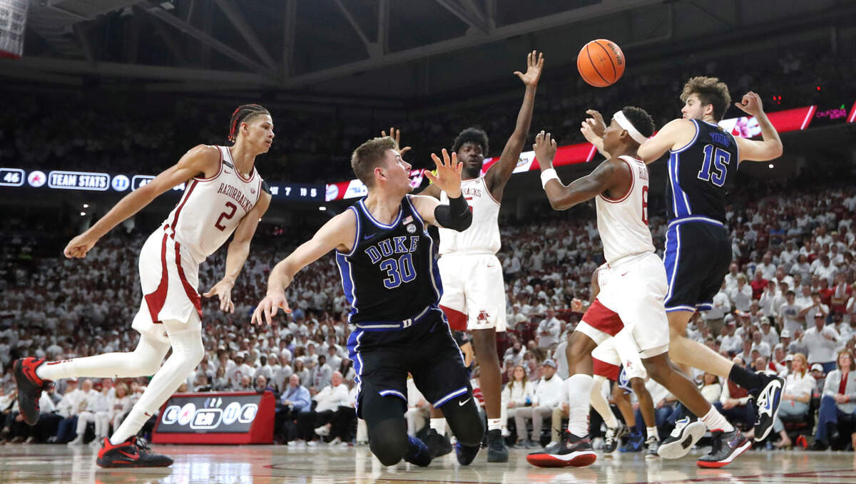 Duke’s Kyle Filipowski (30) watches as he turns the ball over during Arkansas’ 80-75 victory over Duke at Bud Walton Arena in Fayetteville, Ark., Weds. Nov. 29, 2023.