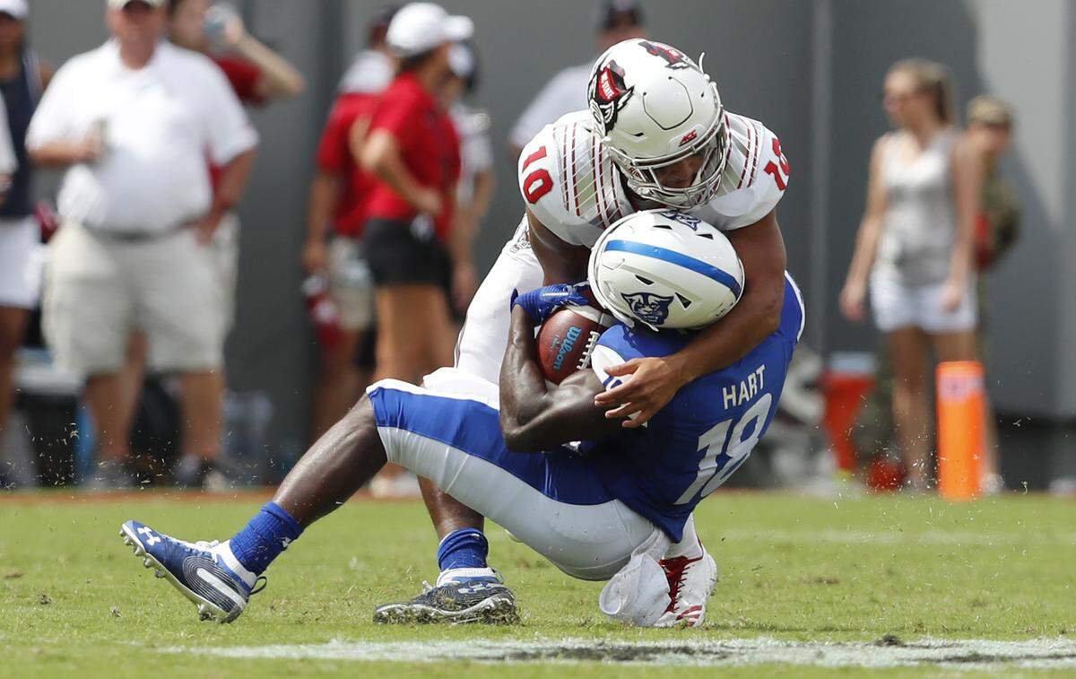 On fourth and one, N.C. State defensive back Tanner Ingle (10) stops Georgia State’s Penny Hart (18) for a loss of six yards during the Wolfpack’s 41-7 victory at Carter-Finley Stadium in Raleigh, N.C., Saturday, Sept. 8, 2018.