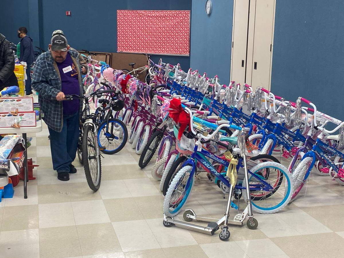 The line at Harnett County social services stretched 300 deep Saturday for the Christmas giveaway led by “Mama Moses” Melanie Stewart.
