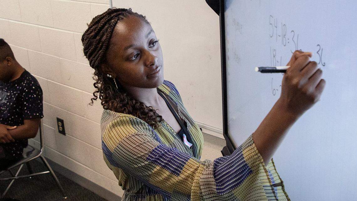 Knightdale High School teacher Alex Johnson reviews examples of sequences during a math class on Tuesday, Sept. 5, 2023, in Knightdale, N.C.