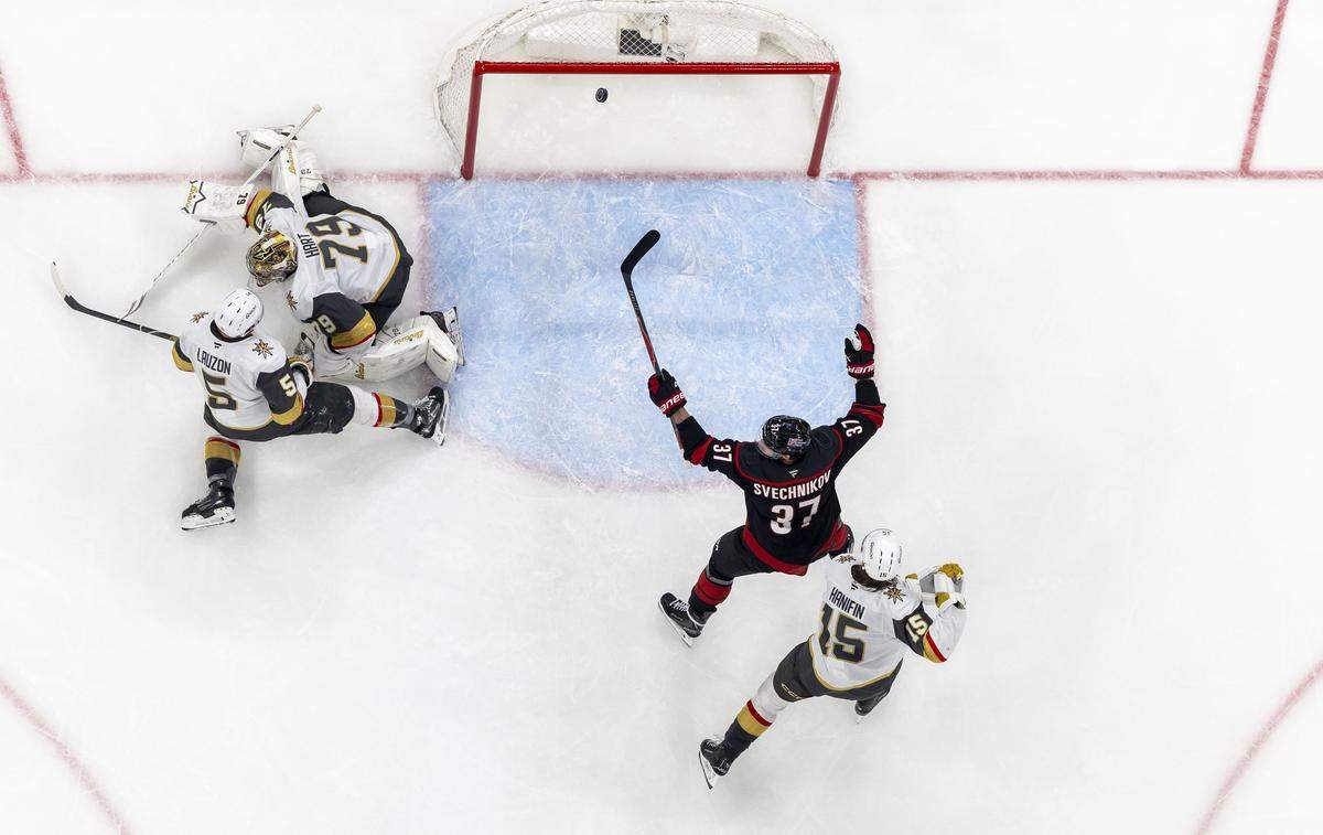 Carolina Hurricanes right wing Andrei Svechnikov (37) reacts after an overtime goal by Seth Jarvis on Vegas goalie Carter Hart (79), to secure a 4-3 victory over Vegas in Game 2 of the Stanley Cup Final, on Thursday, June 4, 2026 at Lenovo Center in Raleigh, N.C.