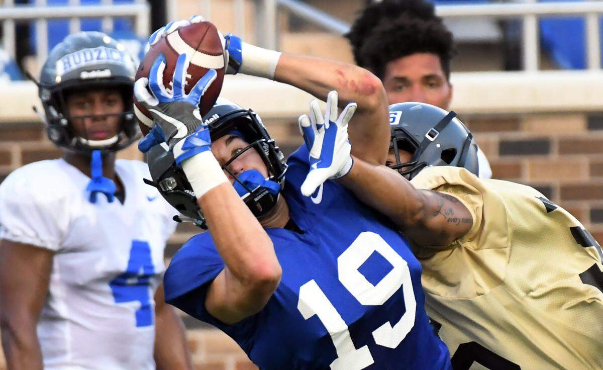 Duke wide receiver Jake Bobo (19)  reels in a pass during the Blue Devils’ scrimmage Saturday, August 11, 2018 at Wallace Wade Stadium in Durham, N.C.